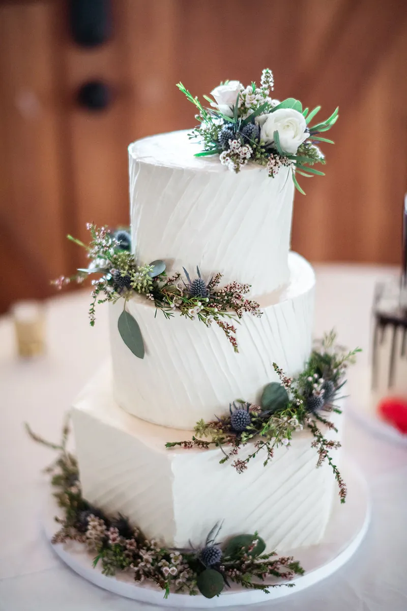 Three tier horizontal homestyle iced wedding cake
